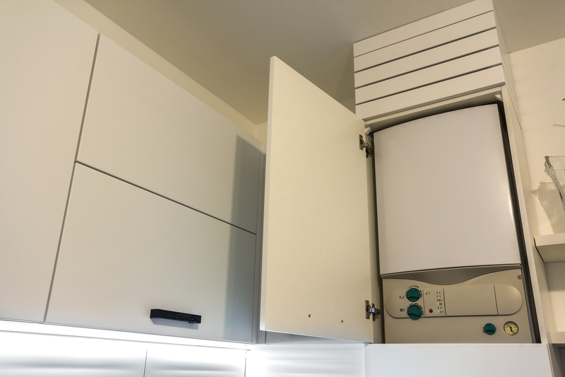 Boiler installed in a kitchen cupboard